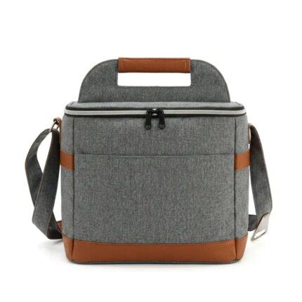 Cooler bag premium Nirvana con acabados en cuero sintético, asa rígida y correa bandolera